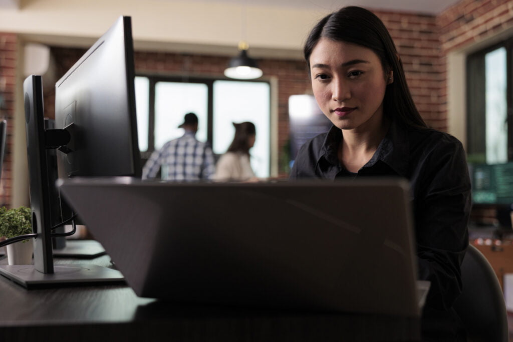 woman working with dynamics 365 on her windows laptop