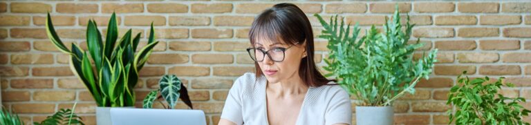 mature woman working from home on her laptop