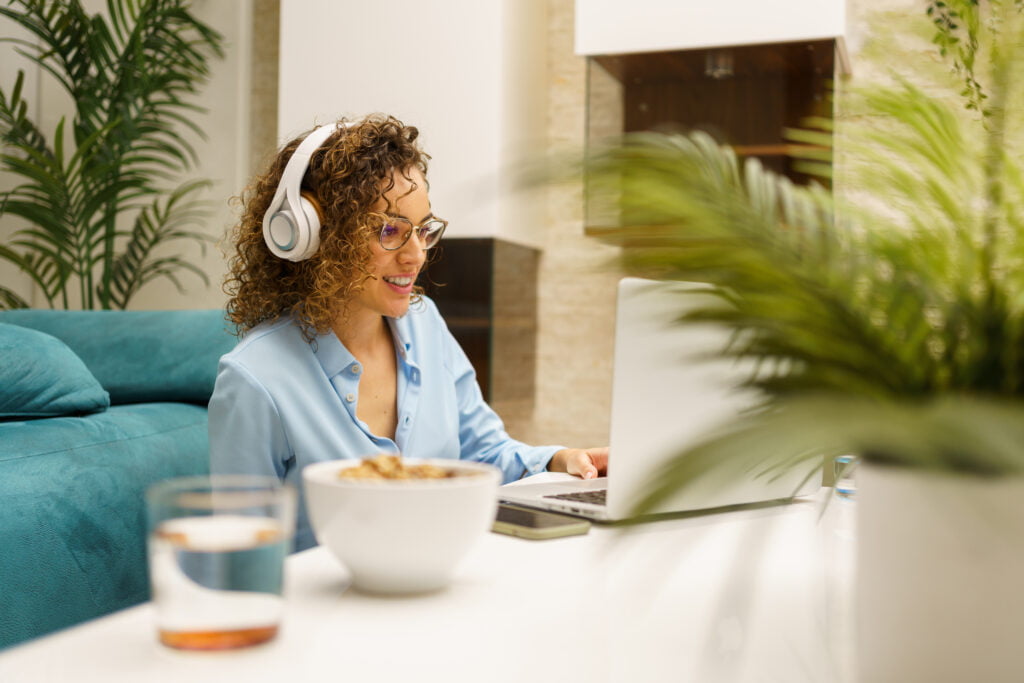 Woman on a call using white headphones